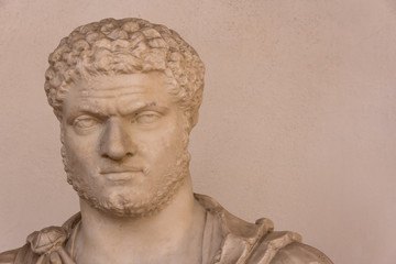 Detail of ancient roman statue head showing a grumpy man