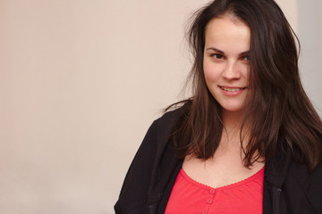 Obraz premium smiling young woman in casual clothes. Portrait plus size model on background