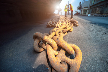anchor chains bundle laying at bottom layer of the ship in floating dry dock, for recondition...