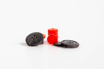 small sewing buttons made of plastic on isolated background 
