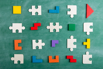 Creative solution for idea - business concept, jigsaw puzzle on the blackboard