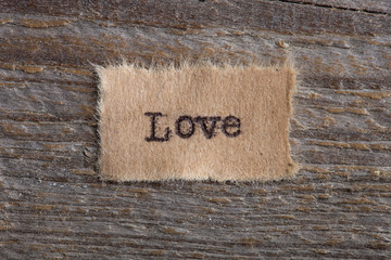 The word "Love" written in vintage wooden letterpress type.