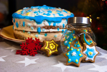 Decorated snowflake  handmade gingerbread cookies with cake. Christmas traditional  background.