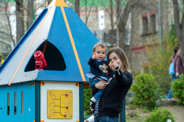 Mother and son teaching moment on a playground