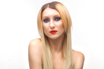 Beautiful blonde woman face studio on white.evening makeup, red lipstick. high key portrait
