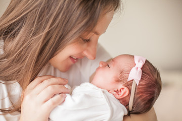 Little baby in mother's hands. Motherhood.