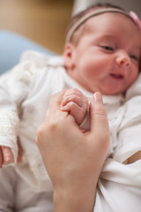 Close-up.Little baby in mother's hands. Motherhood.