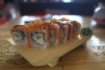 Japanese cuisine / Philadelphia rolls with salmon, and table setting in a traditional restaurant