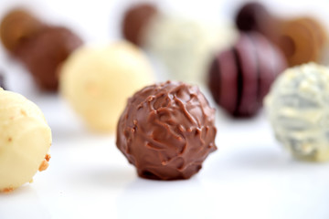 Close-up Assorted of chocolate candies on white background. Selective focus