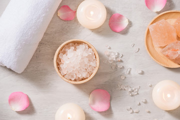 Spa settings with roses. Spa theme with candles and flowers on table.