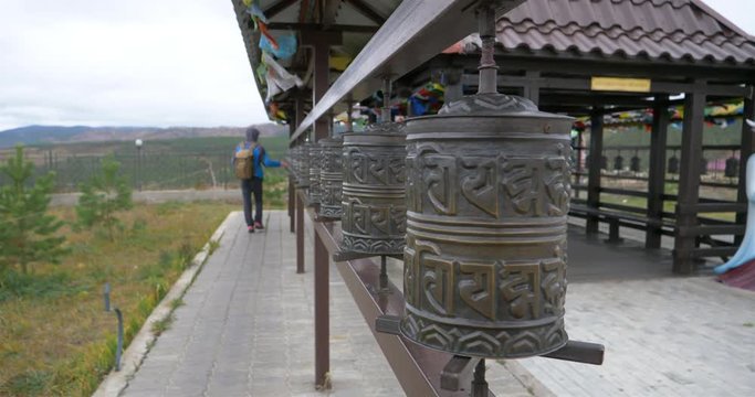 Tibetan prayer wheel rolling in the temple, Ulan Ude Russia