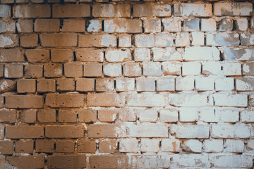 Obraz premium Background of old vintage dirty brick wall with peeling plaster, texture