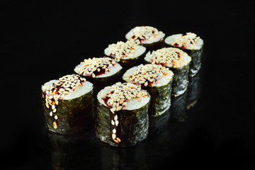Classical roll sushi maki isolated on black background for menu. Japanese food