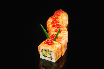 Philadelphia roll sushi with salmon, avocado and smoked eel on black background for menu. Japanese food