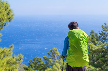 Anonymous man enjoying the view of the Mediterranean sea during a hiking mountain trip. Vacation in Turkey. The Lycian trekking.