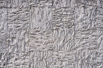 Art abstract geometric grunge texture background, macro. Patterned plaster in the cell.