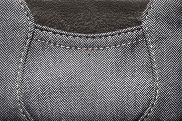 Herringbone fabric, texture background. Black and white tweed pattern, weaving, textile material. 