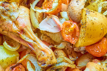 Baked roast chicken legs with various vegetables