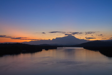 Scenery of beautiful sunrise with river and mountain in Borneo Asia
