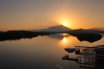 Fototapeta na wymiar Scenery of beautiful sunrise with river and mountain in Borneo Asia