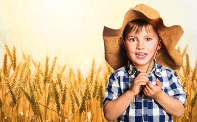 Farmer kid in a wheat field