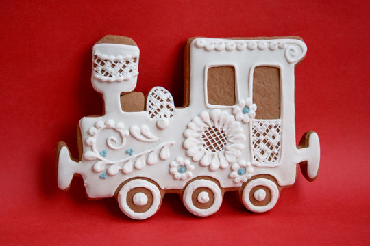 Locomotive made of gingerbread with icing on a colored background