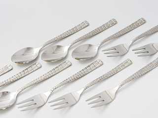 cutlery forks and spoons on a white background