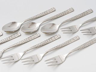 cutlery forks and spoons on a white background