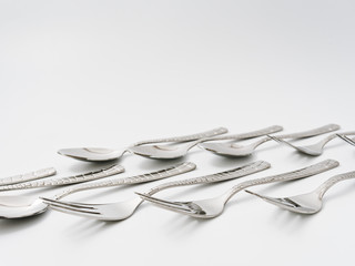 cutlery forks and spoons on a white background