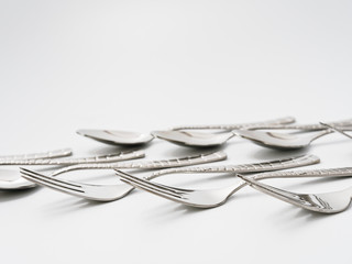 cutlery forks and spoons on a white background