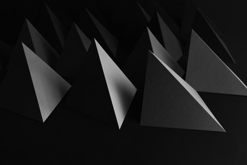 Creative image with triangular elements, pyramids for dark abstract background
