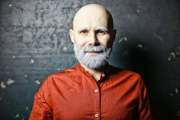 Santa Claus hipster / portrait of a fashionable modern Santa, young man with a gray beard,...