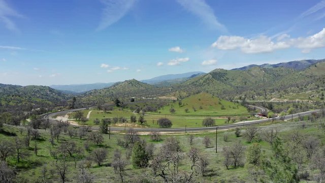 Tehachapi Loop railroad in mountain landscape, California, Aerial Sideways