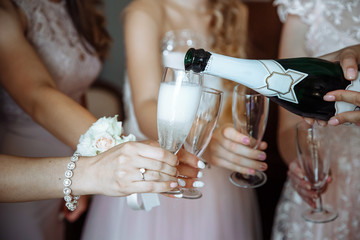 bridesmaids drinking champagne at a wedding