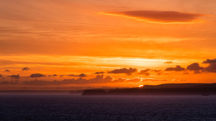 Sunrise at summer solstice at Pentire Point in North Cornwall, England UK