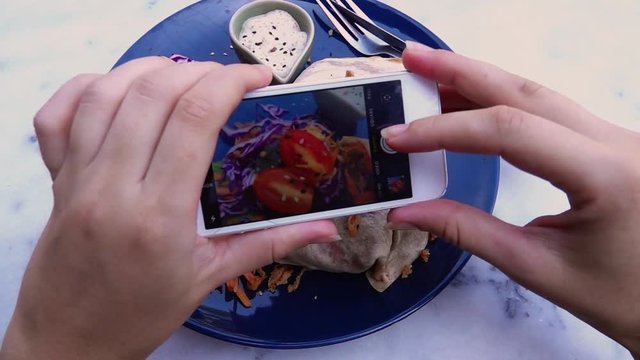 Female Hands Taking Food Photo of Vegan Lunch on Mobile Phone for Social Media or Blogging