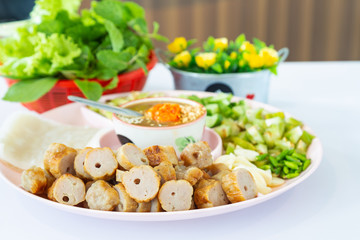 Vietnamese meatball with rice paper rolls and salad.