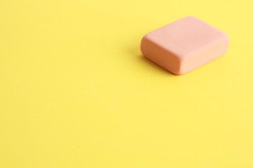 pink eraser on colorful background