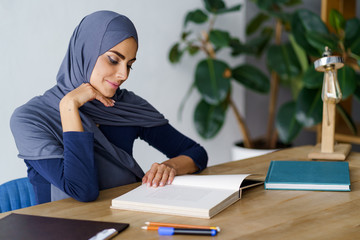 Arabian woman reading a book