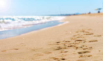 Footprints in the sand at the sea
