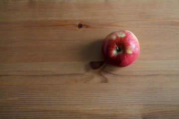 one red Apple on wooden background