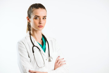 Fototapeta premium Young nurse in a scrub uniform wearing a stethoscope.