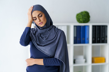 Muslim woman having a headache