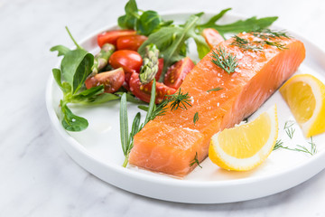 Serving cold smoked salmon fish, restaurant dish on plate