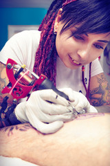 Session of tattooing in studio during making picture on calf