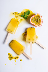 Homemade popsicles with passion fruit juice