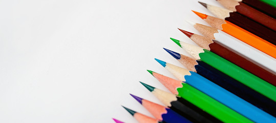 Colored pencils on a white background, with space for your text, blank for banner