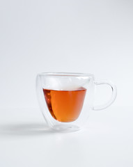 Cup Hot black tea, front view isolated on white background.