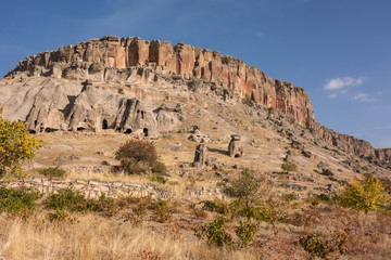 Fototapeta premium View of Cappadocia. Turkey. A geological formation consisting of volcanic tuff with cave dwelling. Cave monastery in Goreme Central Anatolia.