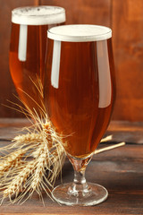Glass beer on wood background